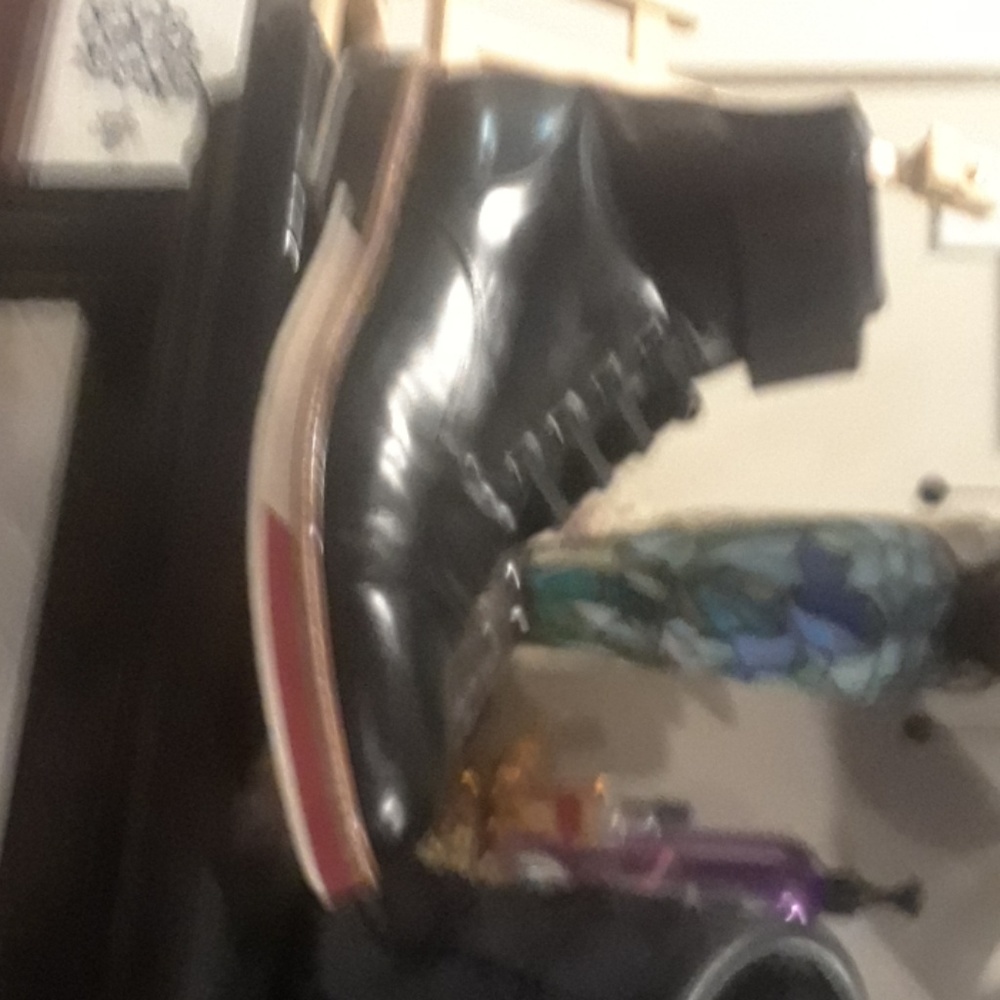 A pair of 1700 dollar Louis Vuitton designer boots